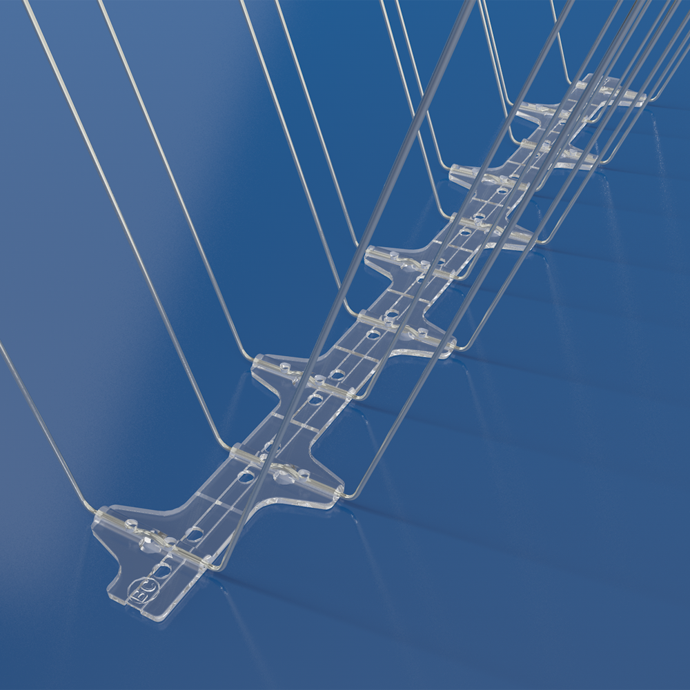 Close-up of a BC Bird Spikes 20M spike tip against a blue background, showing the 1.4mm corrosion-resistant steel construction