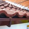 Close-up of Birdcomb in position under roof tiles, showing secure fit and ventilation gaps