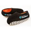 Pair of tan work boots fitted with The Original CleanBoot® overshoes, highlighting secure fit and clean presentation.